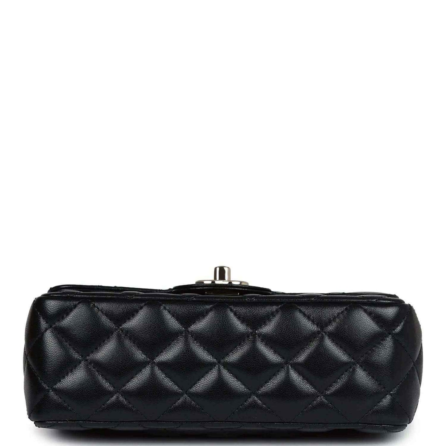 Top view of mini black quilted leather flap bag with metal post closure