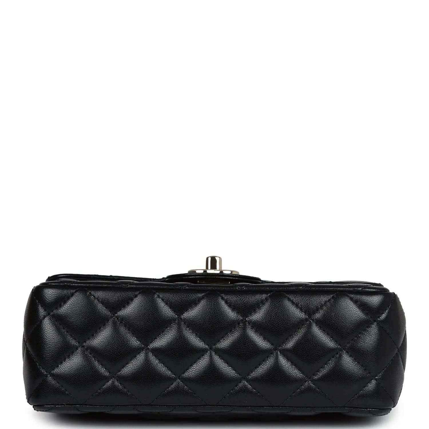 Top view of mini black quilted leather flap bag with metal post closure