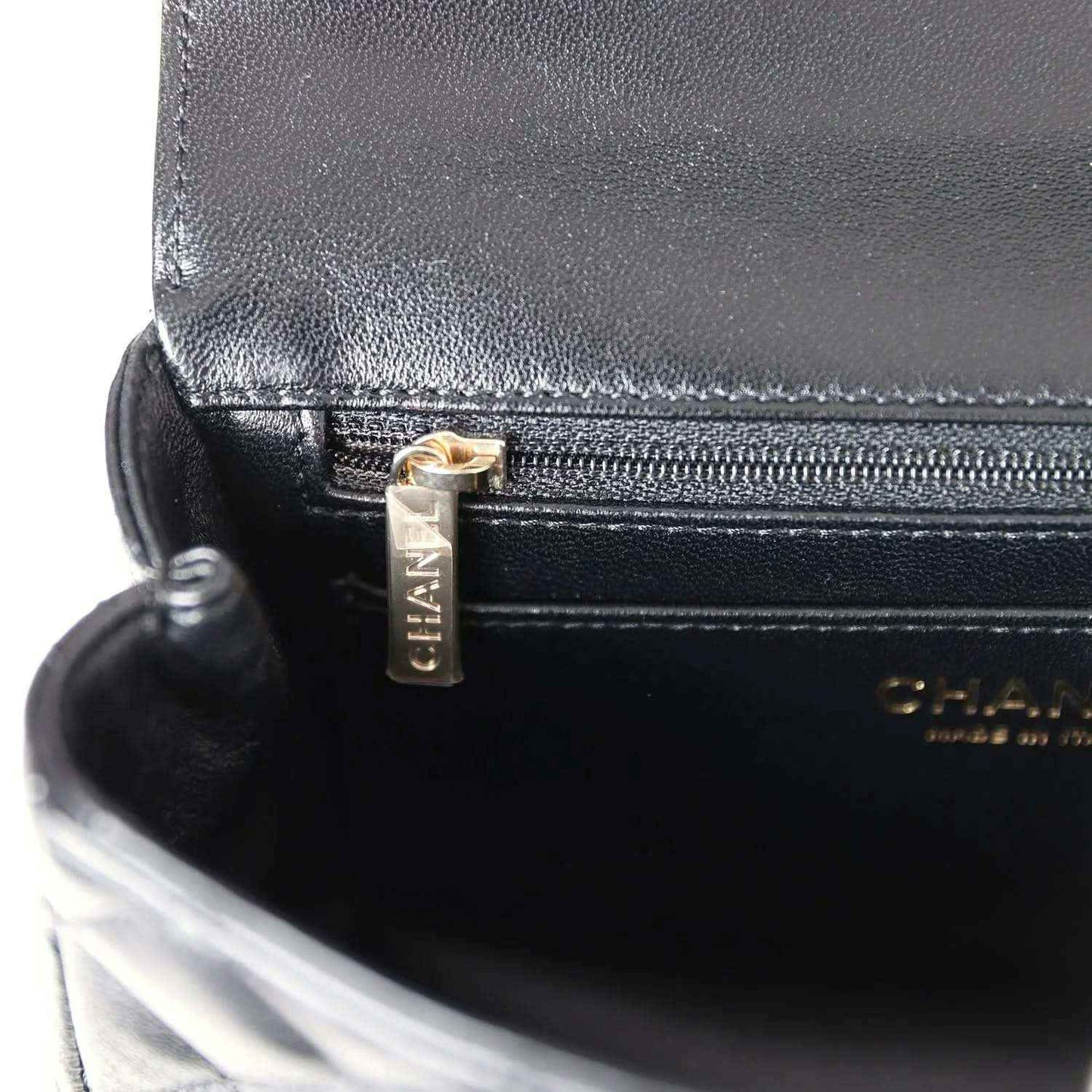 Chanel mini rectangular flap bag, black leather front clasp detail