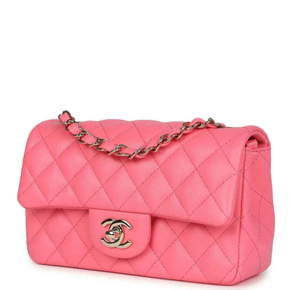 Hot pink quilted mini flap bag with gold-tone chain strap and front logo emblem