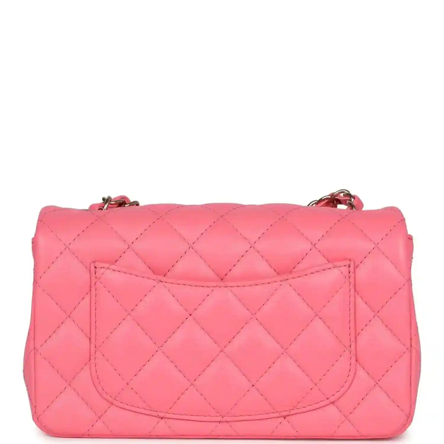 Hot pink quilted mini flap bag with top flap and gold-tone chain attachment