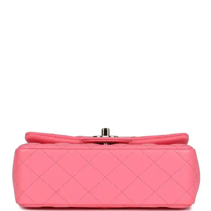 Hot pink quilted mini flap bag with metal turn-lock clasp on base