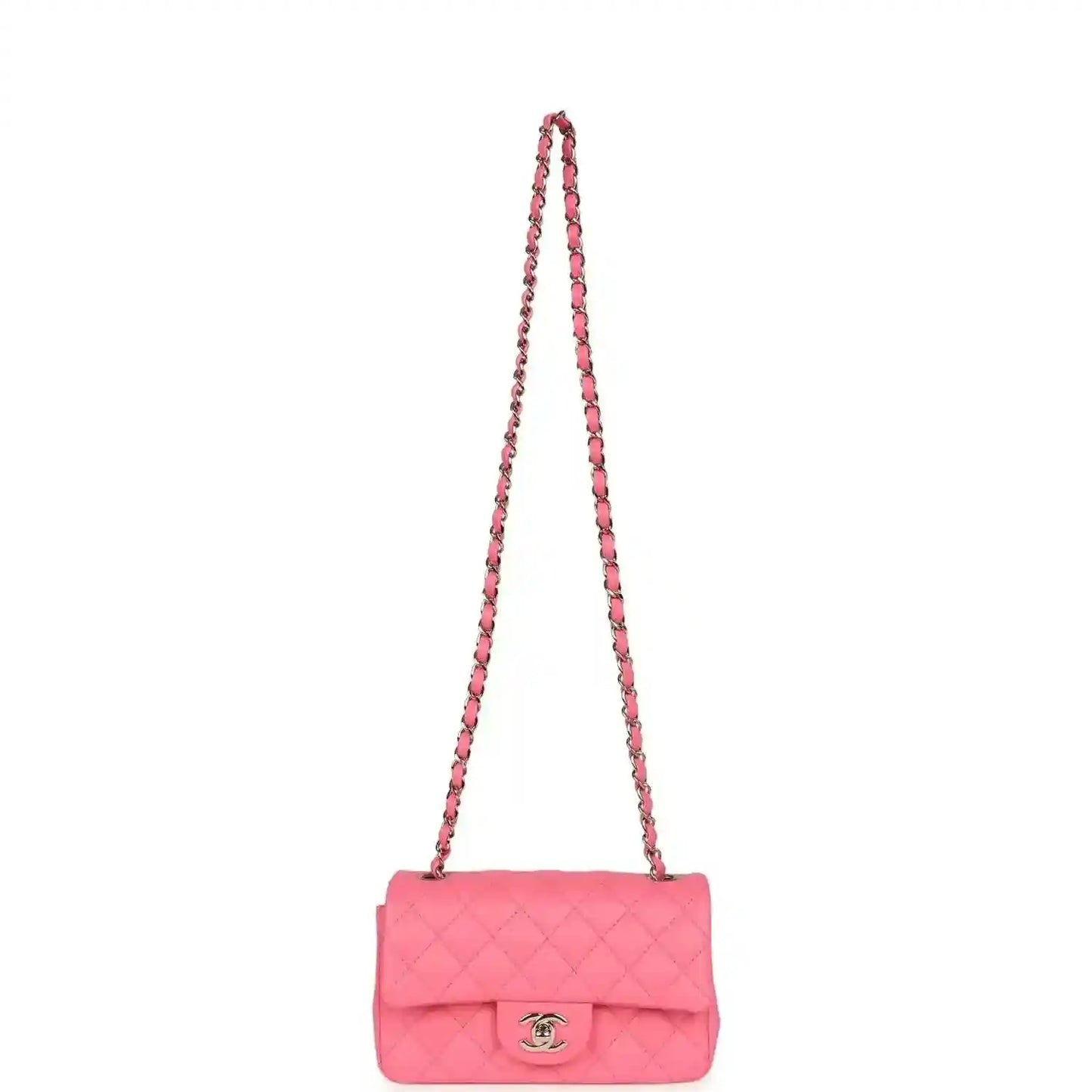 Hot pink quilted mini flap bag with long chain strap and front logo emblem