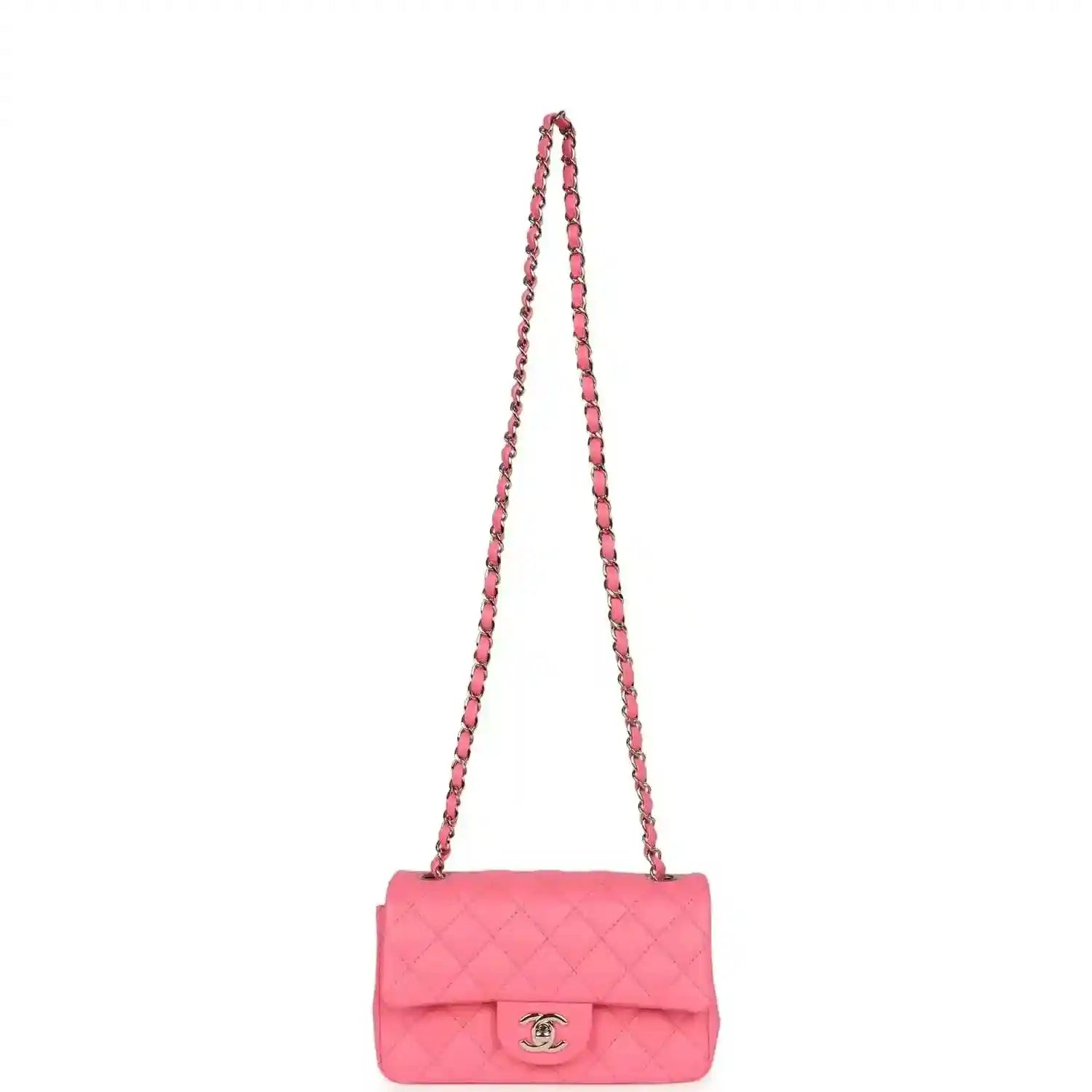 Hot pink quilted mini flap bag with long chain strap and front logo emblem