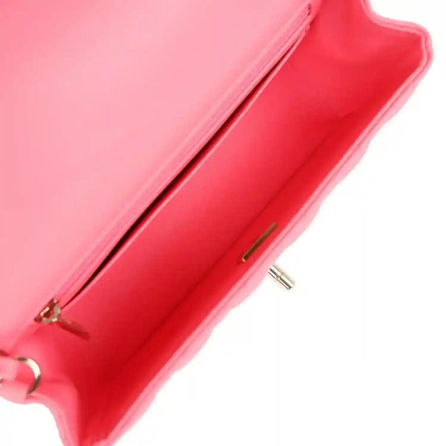 Hot pink mini flap bag open corner showing red lining and zipper detail