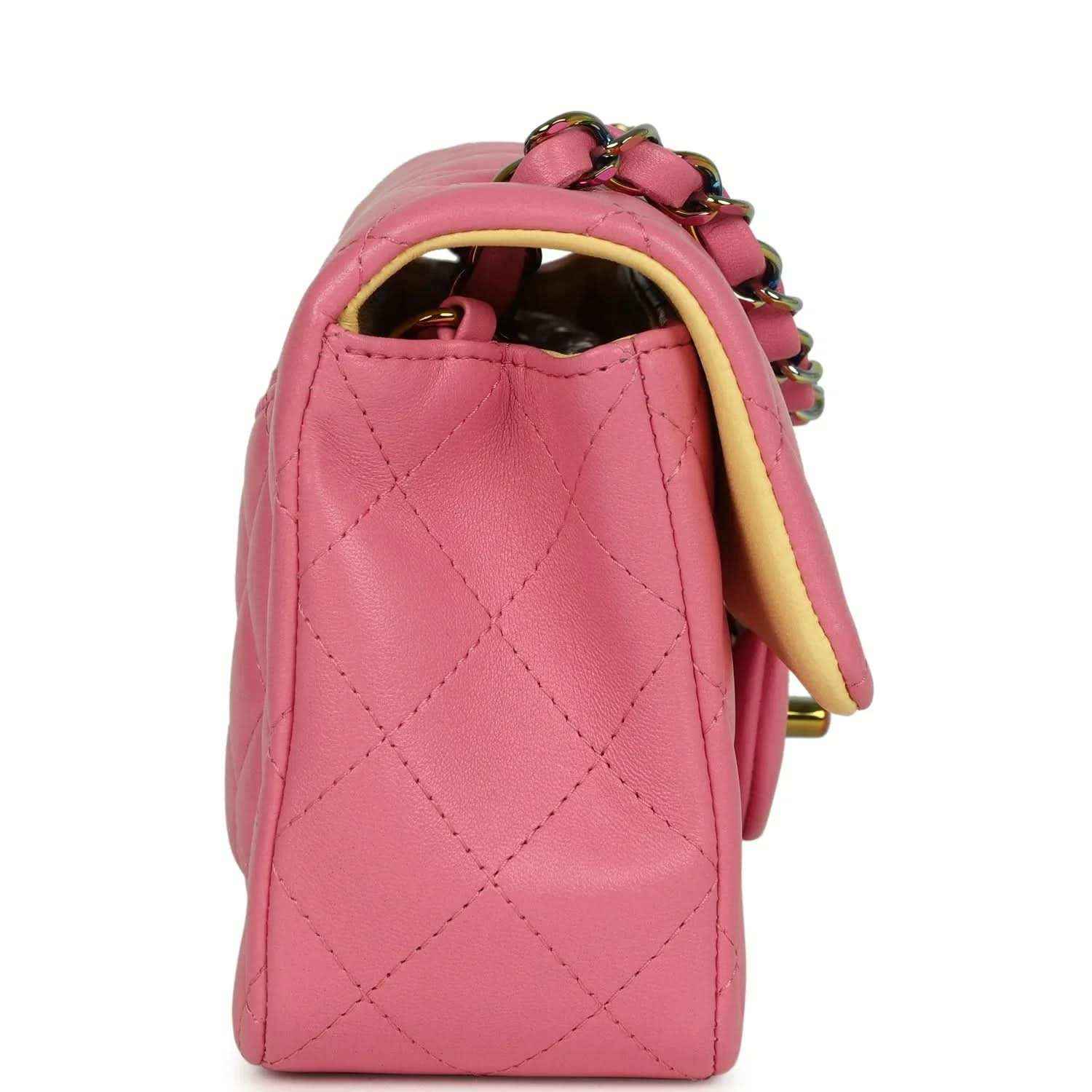 Pink quilted mini flap bag side view with chain strap and curved handle