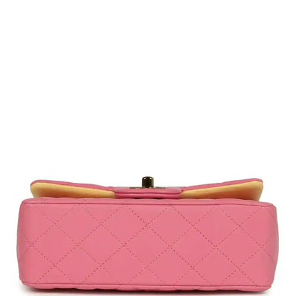 Pink mini rectangular flap bag back view with quilted pattern and top bar clasp