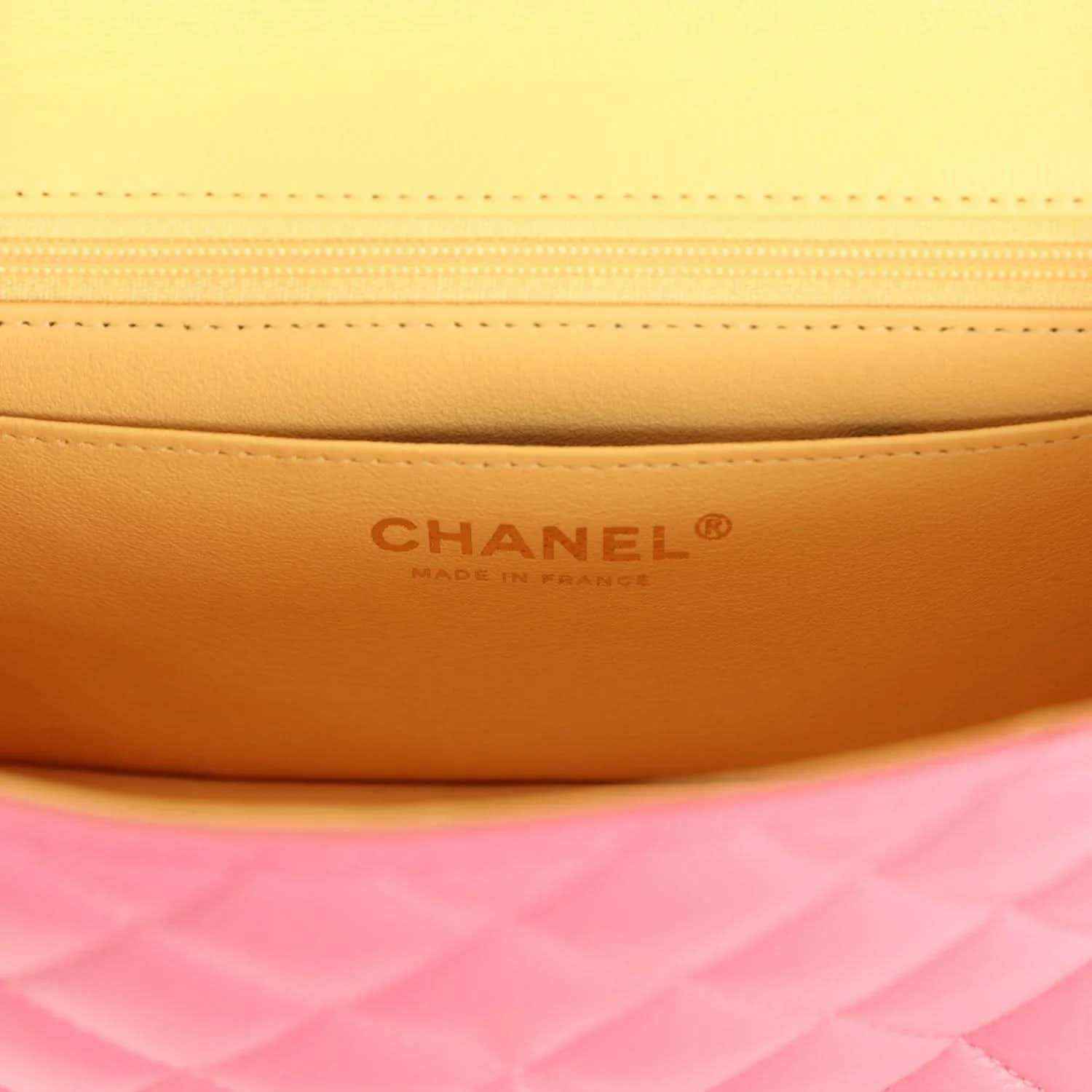 Mini flap bag interior panel with Chanel logo branding and stitched seam