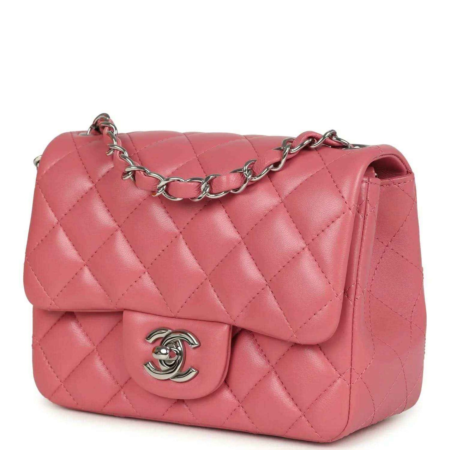 Pink quilted lambskin mini flap bag front view with silver chain strap and CC logo