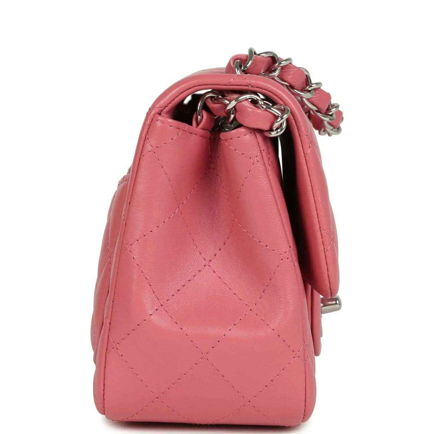 Pink lambskin mini flap bag side view with chain handle and silver hardware