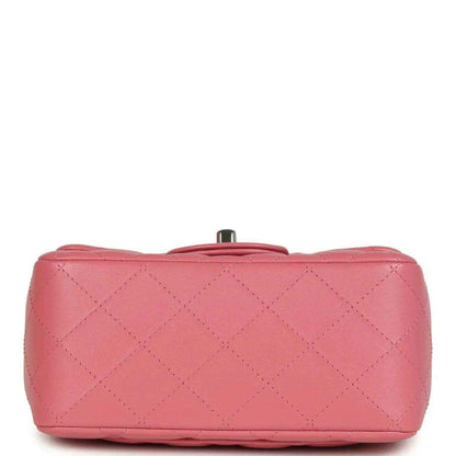 Pink lambskin mini flap bag bottom view with small metal base post