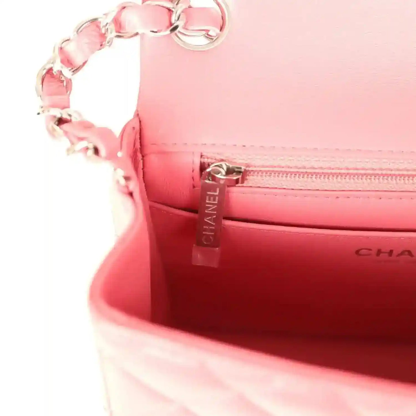 Pink leather-lined interior with Chanel zipper pull and CHANEL logo label