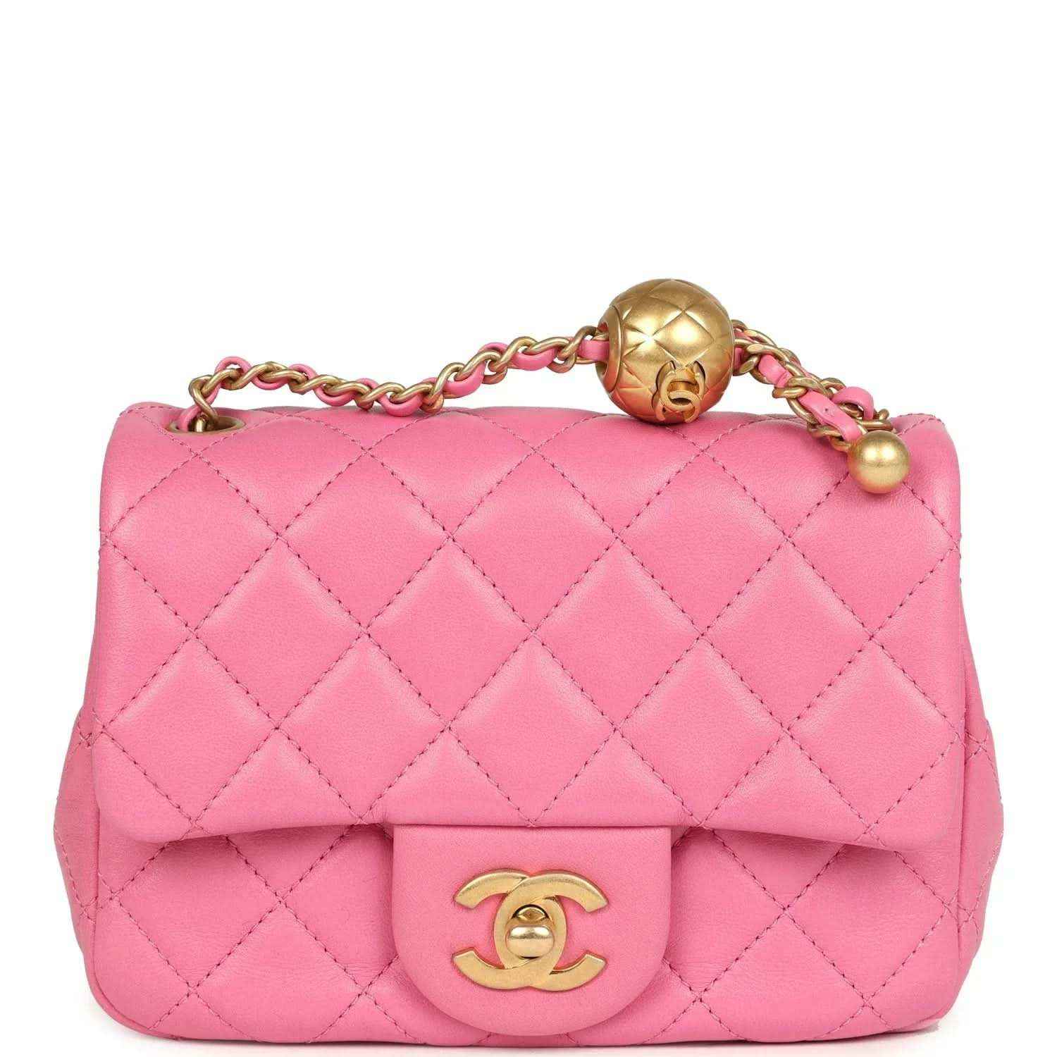 Pink quilted mini square flap bag with gold-tone turn-lock and chain strap.