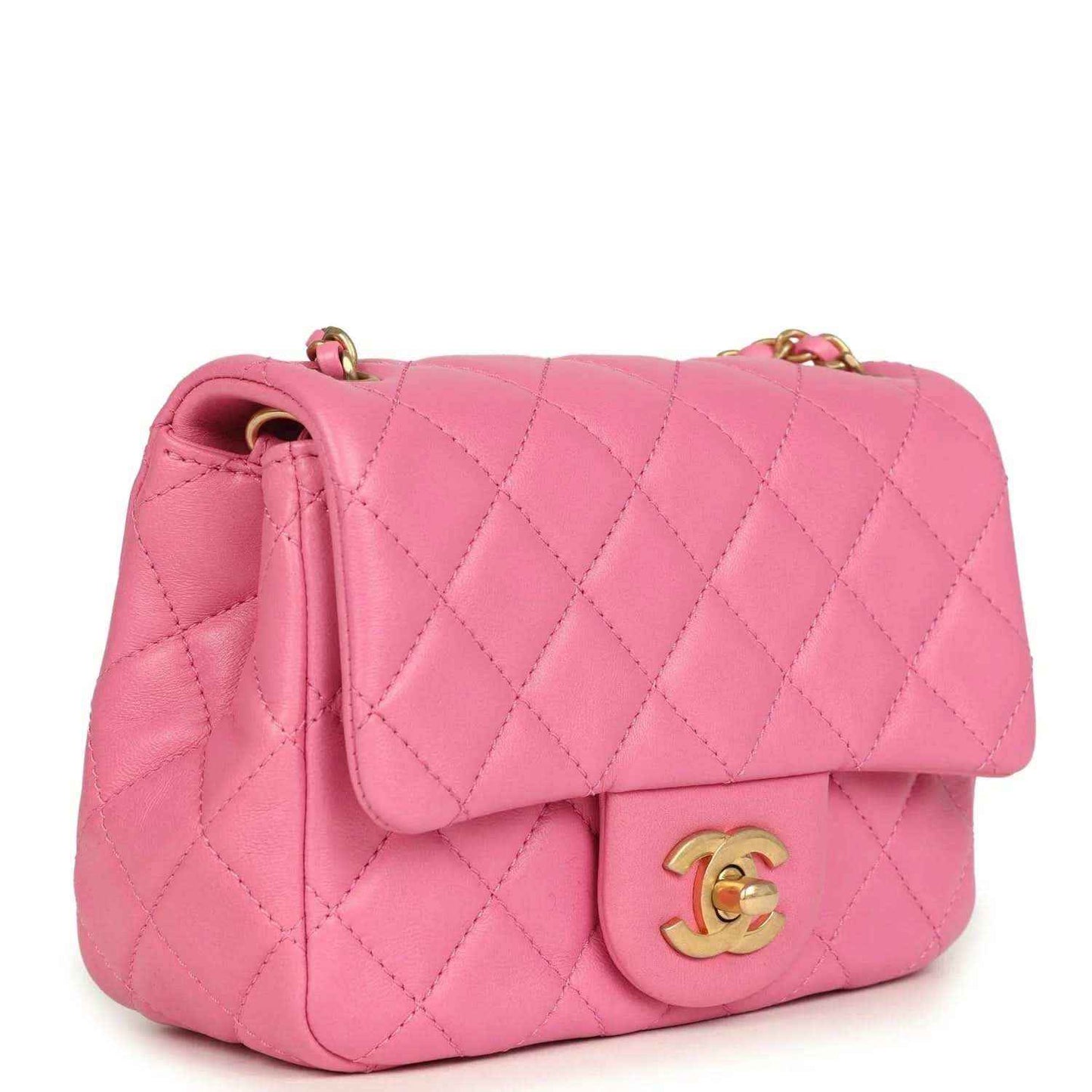 Pink quilted mini flap shoulder bag with gold-tone CC logo and chain strap.