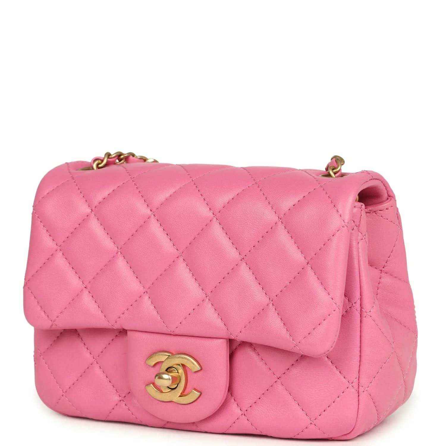 Pink quilted mini flap bag with gold-tone CC clasp and partial chain strap.