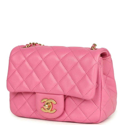 Pink quilted mini flap bag with gold-tone CC clasp and partial chain strap.