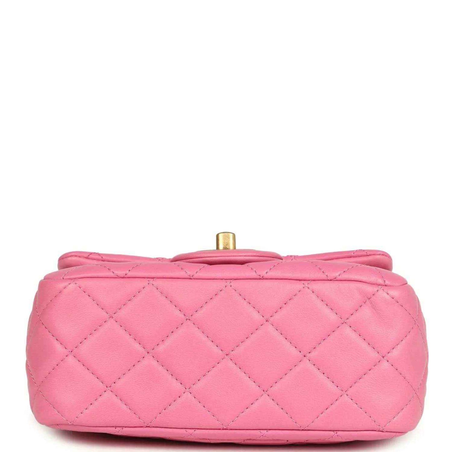 Pink quilted mini bag profile with gold-tone top post and carry handle loop.