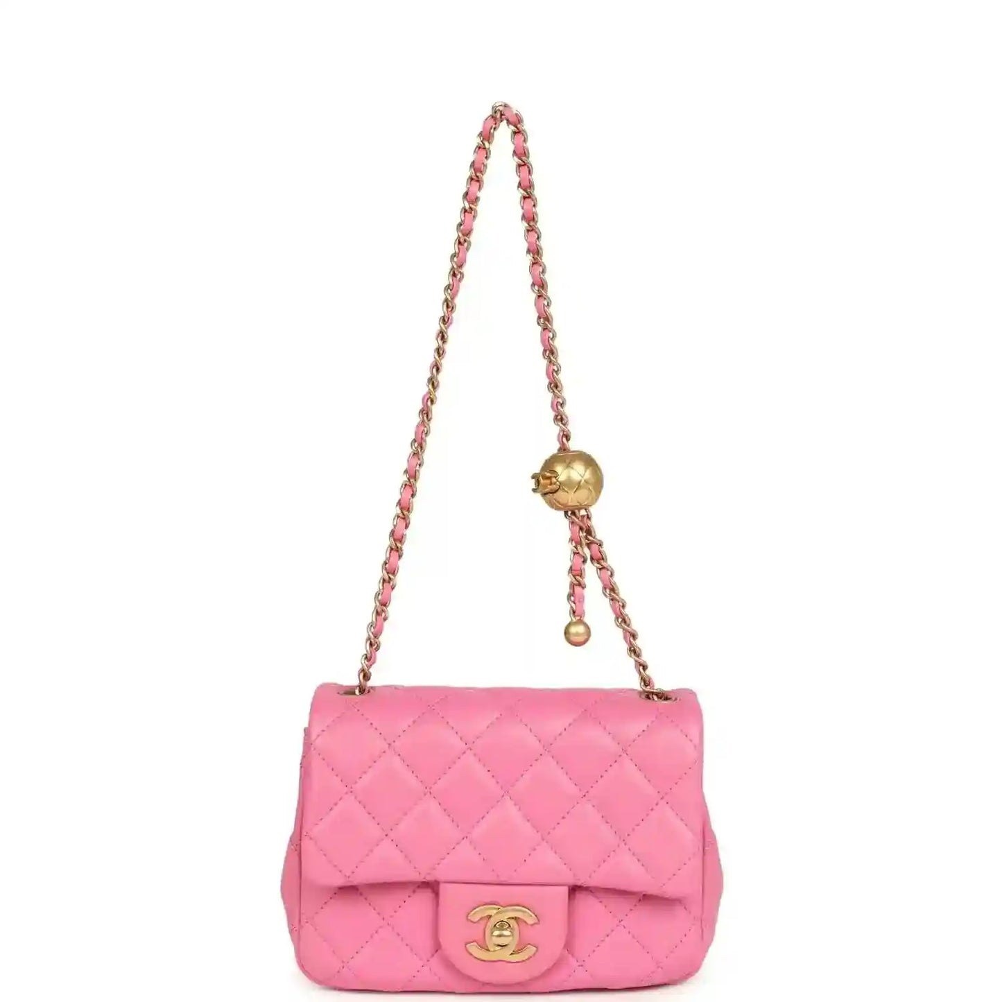 Pink quilted mini shoulder bag with chain strap and gold-tone CC turn-lock.