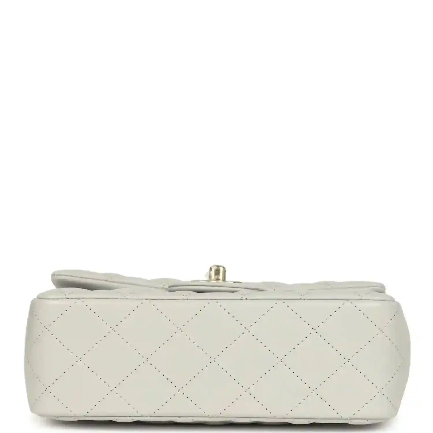 Chanel mini flap bag base view, quilted light leather with small hardware at top