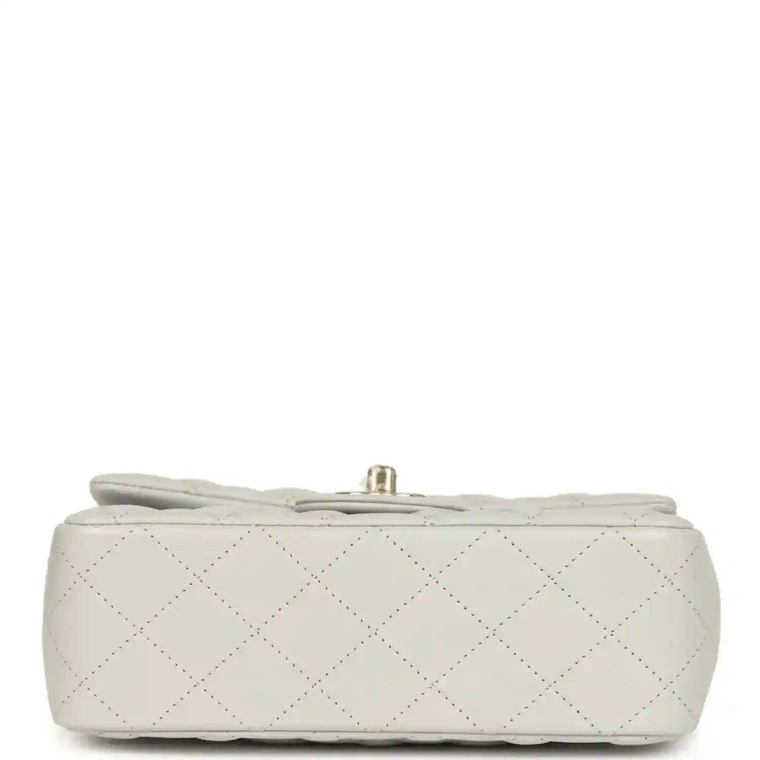 Chanel mini flap bag base view, quilted light leather with small hardware at top