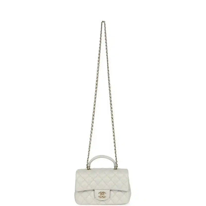 Chanel mini flap bag with shoulder chain, quilted light leather and CC clasp