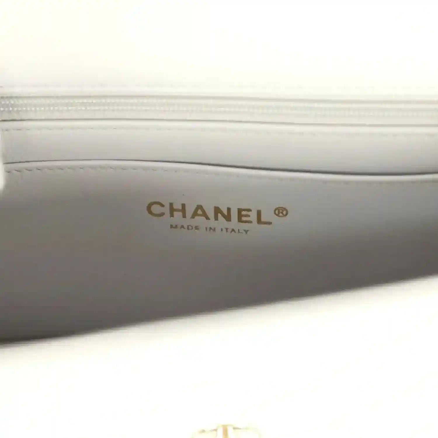 Chanel mini flap bag interior stamp reading CHANEL and MADE IN ITALY