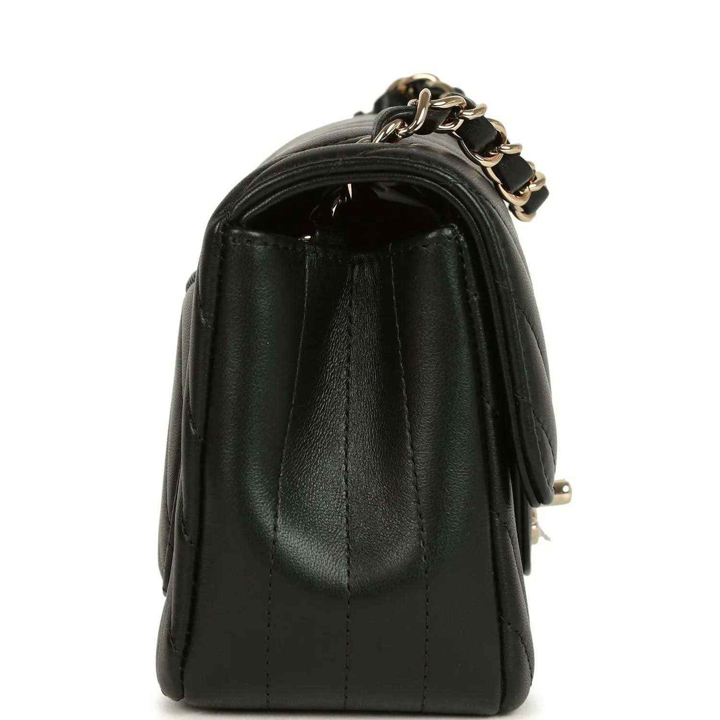 Chanel mini rectangular chevron flap bag, black lambskin on its side profile