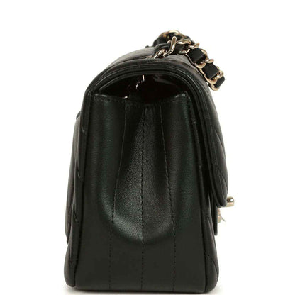 Chanel mini rectangular chevron flap bag, black lambskin on its side profile