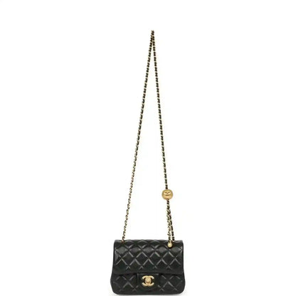 Black mini flap bag on gold chain with quilted front and CC emblem