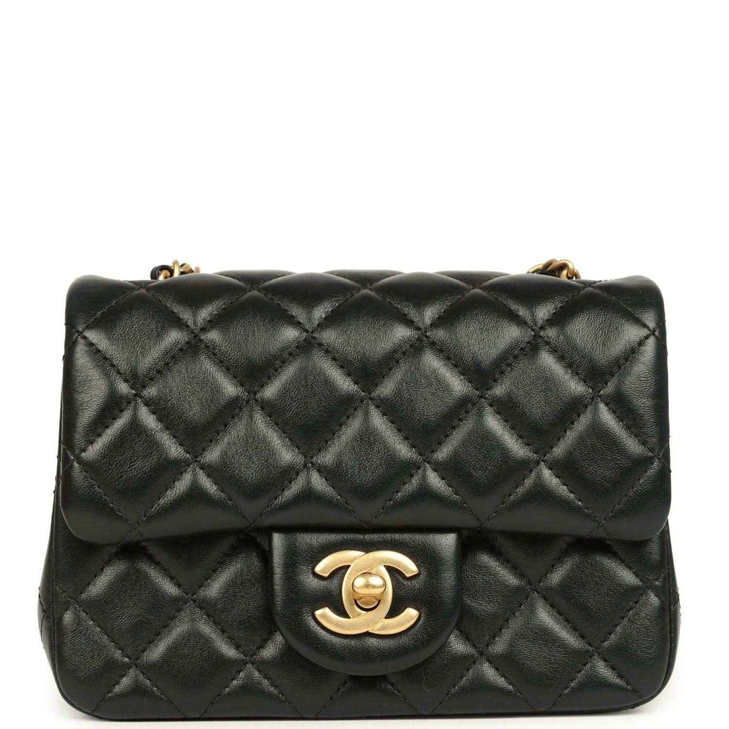 Black quilted mini flap bag with gold CC turn-lock and chain strap