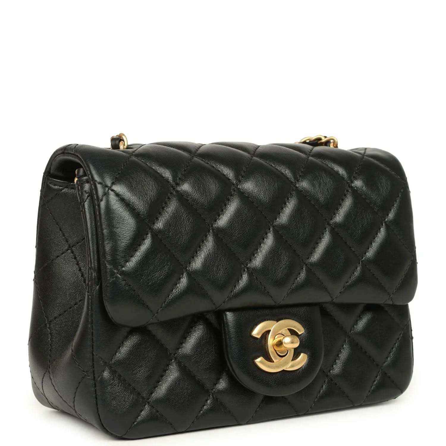 Black quilted mini flap bag with gold CC clasp and shoulder chain