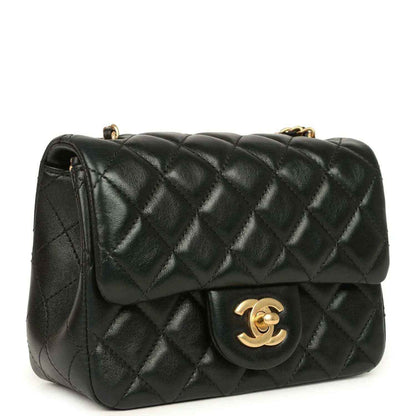 Black quilted mini flap bag with gold CC clasp and shoulder chain
