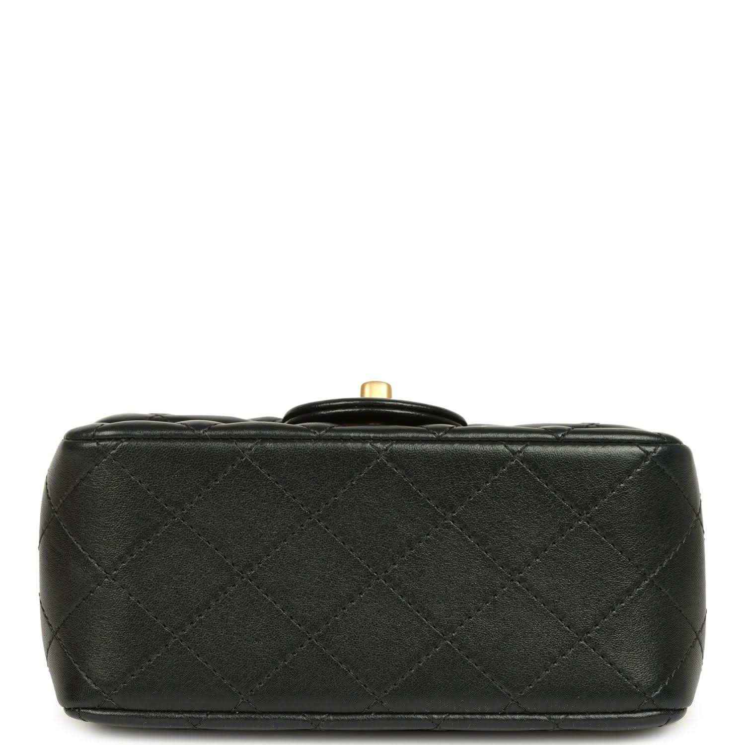 Black quilted mini flap bag bottom with gold-tone top hardware