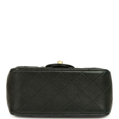 Black quilted mini flap bag bottom with gold-tone top hardware