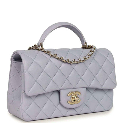 Mini rectangular flap bag in light purple quilted leather with gold-tone chain and front flap
