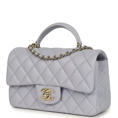 Mini rectangular flap bag in light purple quilted leather with gold-tone CC logo on front