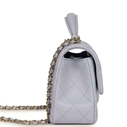 Mini rectangular flap bag side view in light purple quilted leather with chain strap