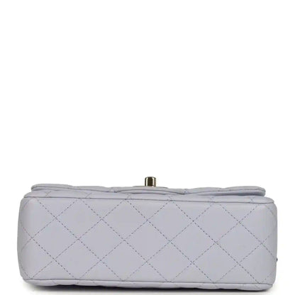 Mini rectangular flap bag back view in light purple quilted leather with small top bar