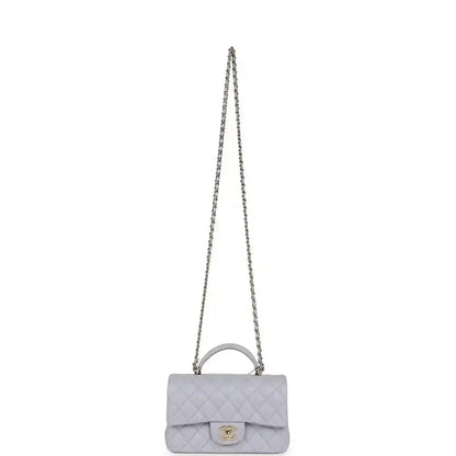 Mini rectangular flap bag with long chain strap in light purple quilted leather and CC logo