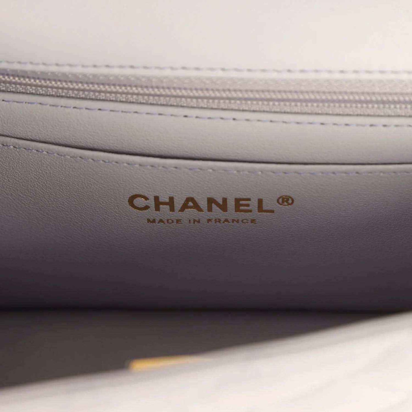 Mini rectangular flap bag lining with CHANEL and MADE IN FRANCE text in gold lettering