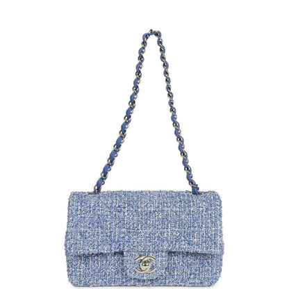 Blue and white tweed mini flap bag with chain strap and silver CC logo on front