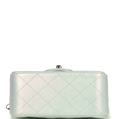 Mini square flap bag back view in iridescent light blue quilted leather with top closure hardware