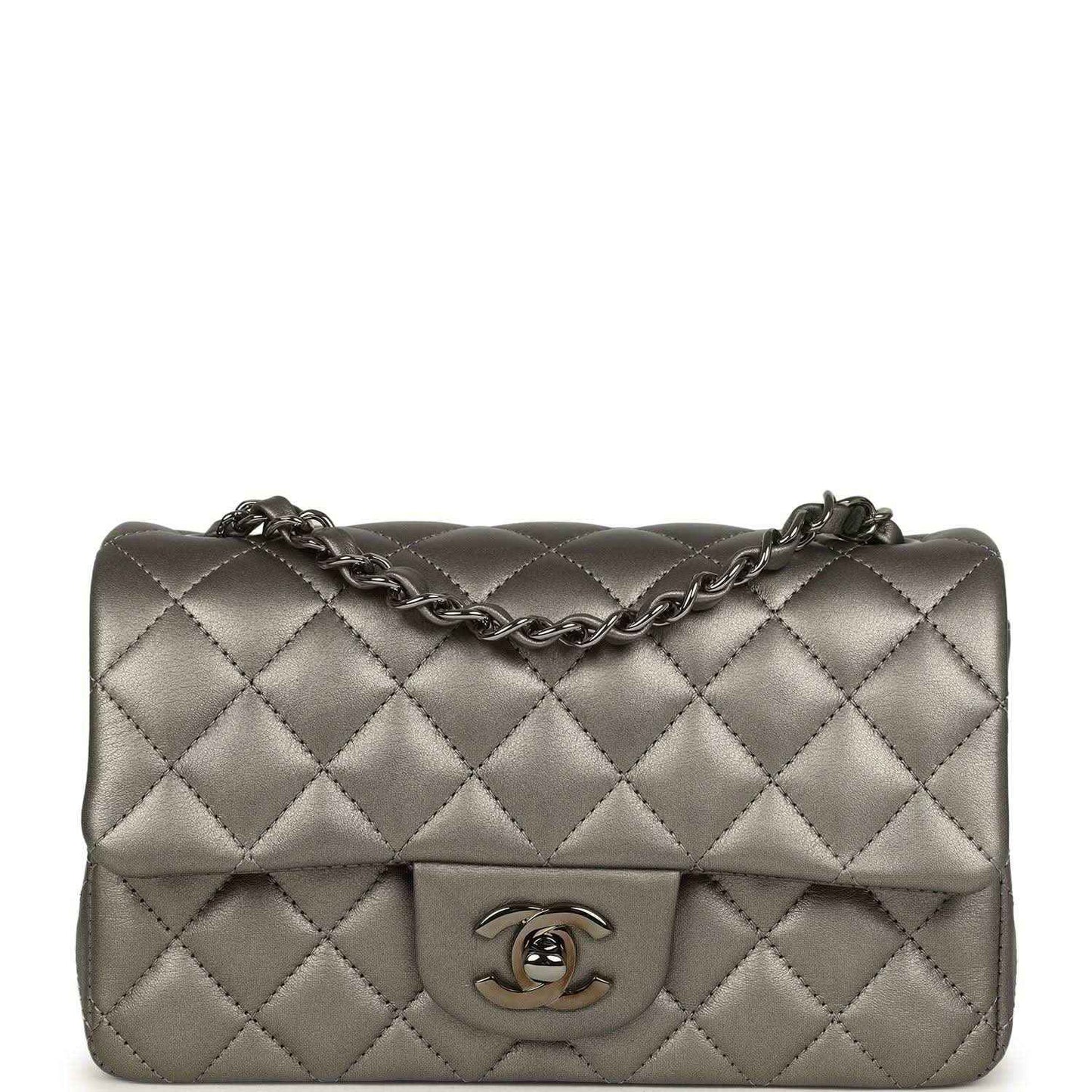 Quilted silver mini flap bag with chain strap and Chanel CC logo on front
