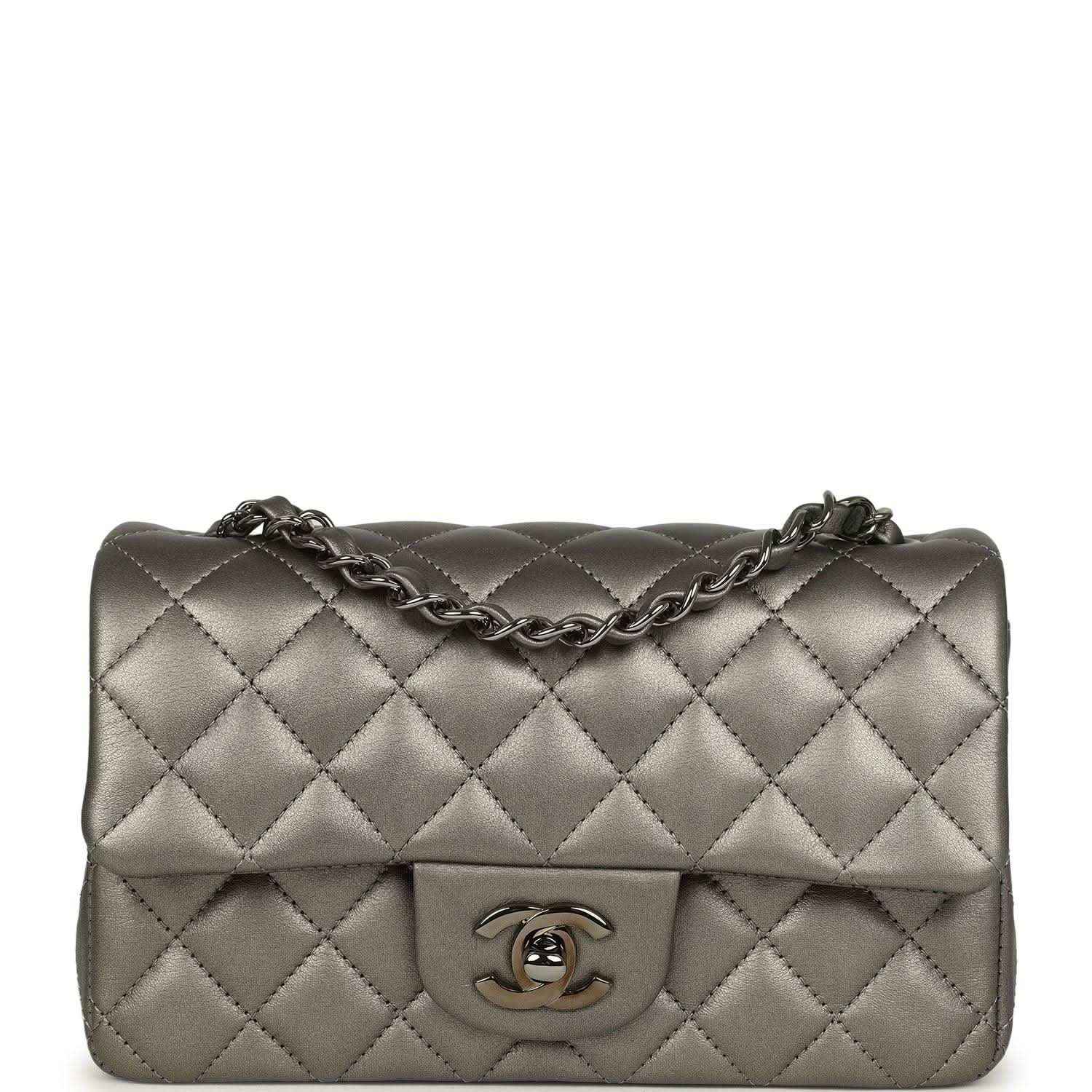 Quilted silver mini flap bag with chain strap and Chanel CC logo on front