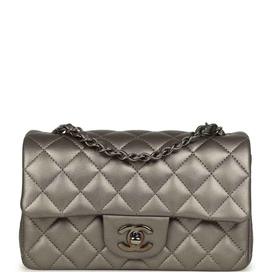 Quilted silver mini flap bag with chain strap and Chanel CC logo on front