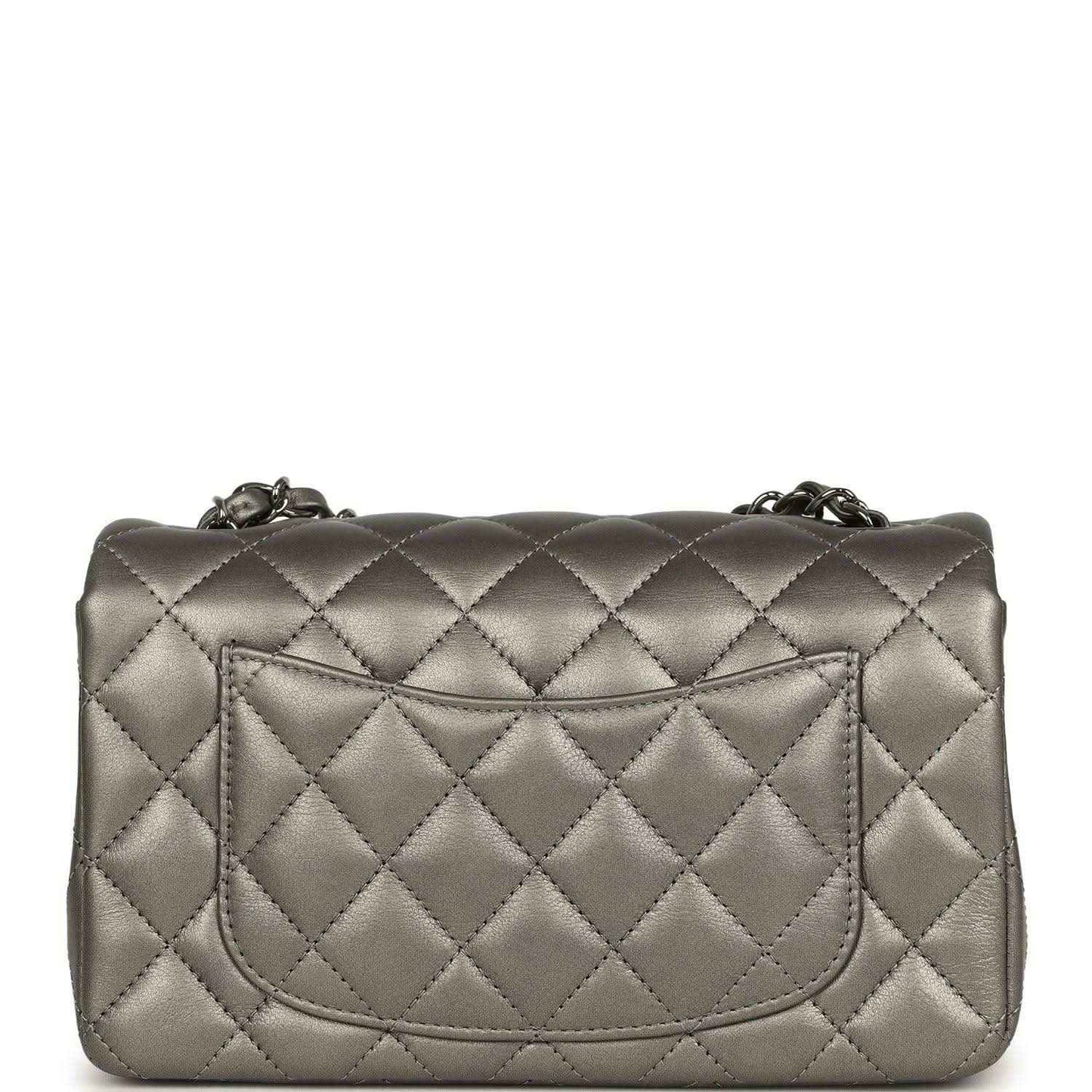 Silver quilted mini flap bag back with recessed pocket and chain hardware