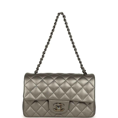 Silver quilted flap bag with chain strap and Chanel CC logo on front