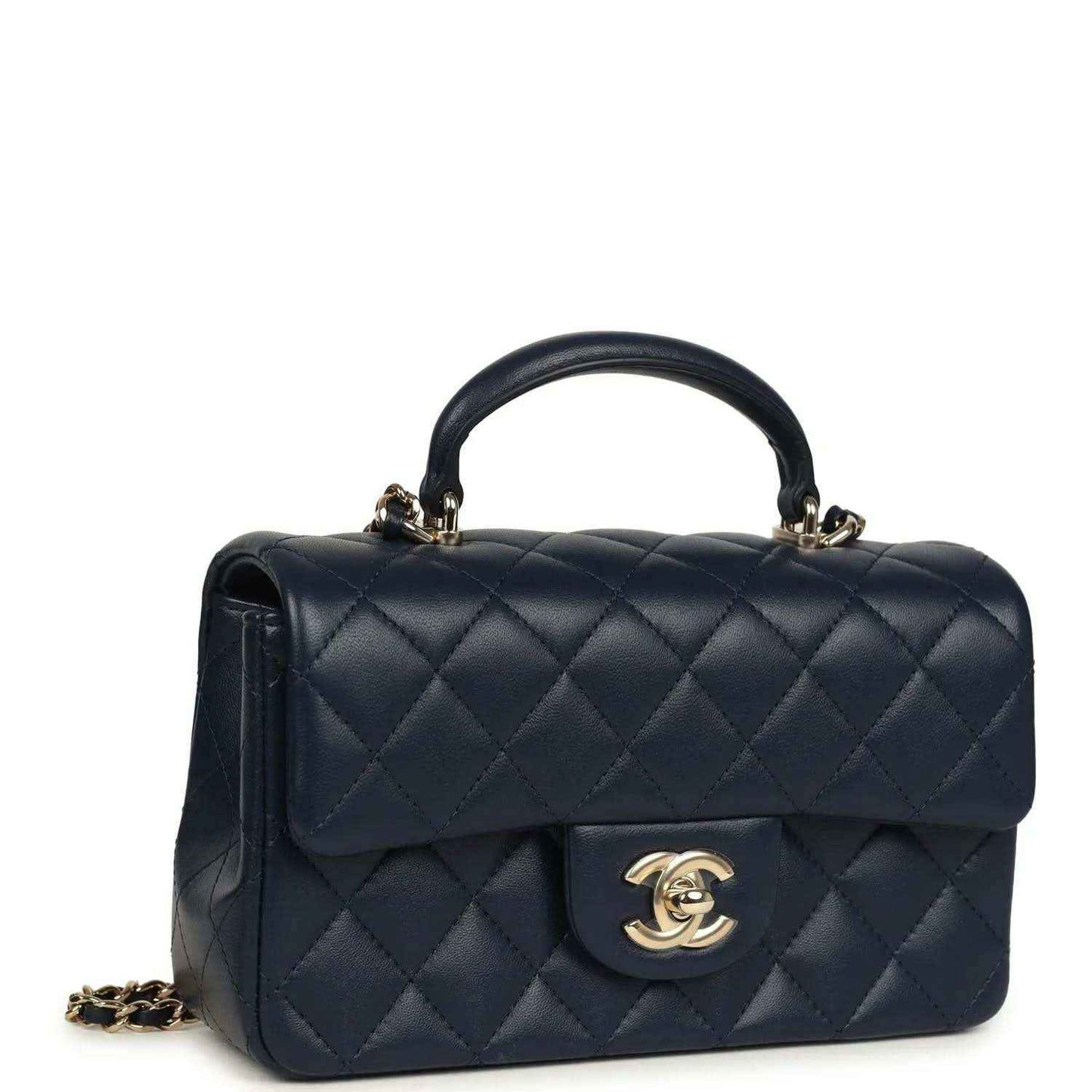 Navy quilted flap top handle bag with gold-tone chain strap and CC logo
