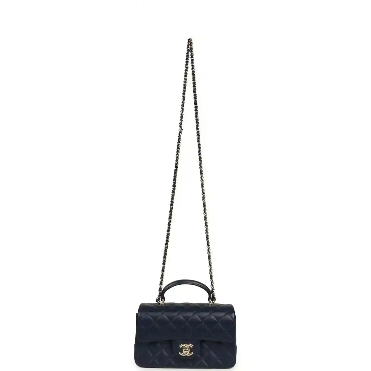 Navy mini crossbody flap bag with long chain strap and CC logo