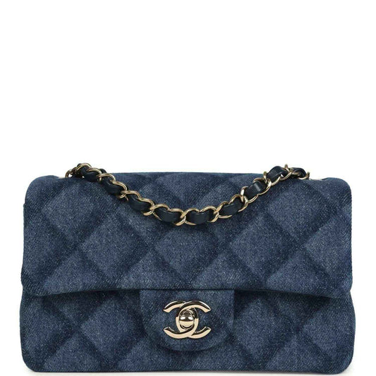 Chanel mini flap bag in blue denim with quilted pattern and gold chain strap